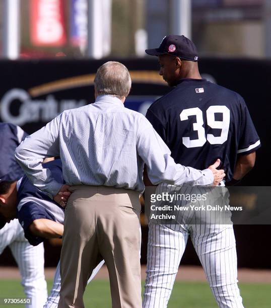 New York Yankees' owner George Steinbrenner puts his arm around Darryl Strawberry at team's camp in Tampa, Fla. Strawberry has been barred from...