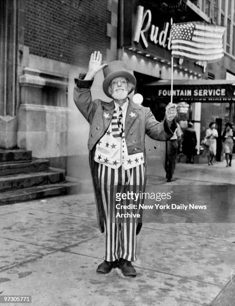 Max Maxwell Landar, dressed as Uncle Sam, greets a passerby at 42nd St. And Third Ave.