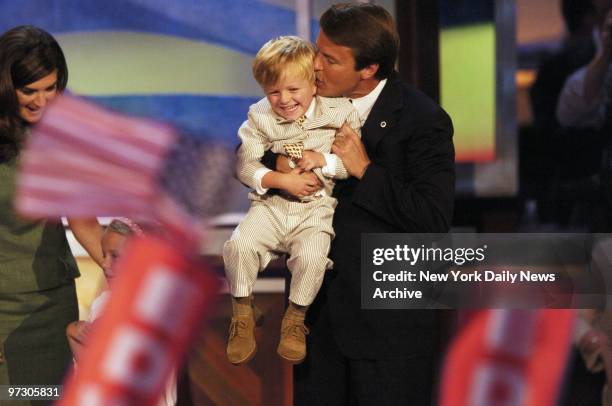 John Edwards gives his giggling son, Jack, a kiss on the ear after addressing the Democratic National Convention at the FleetCenter in Boston.