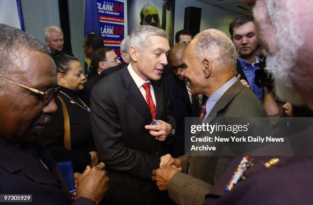 Gen. Wesley Clark shakes hands with Roscoe Brown at a campaign stop in Harlem. Brown, known as the Tuskegee Airman, helped integrate the armed forces...