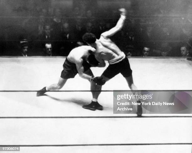 Maxie Rosenbloom sends a sweet left uppercut to Abie Bain in the second round of their fight at the Garden. ,
