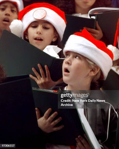 Children from The Nativity Blessed Virgin Mary grammar school in Ozone Park, Queens participate in "Sing on Sixth Avenue," a Christmas concert...