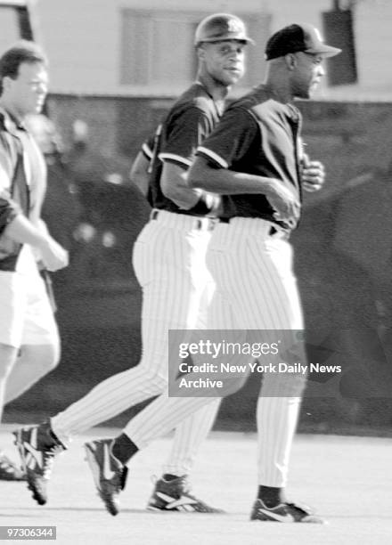 Darryl Strawberry, left, and Dwight Gooden run in the outfield at the New York Yankees minor league camp in Tampa, Fla. Thursday Oct. 19, 1995.