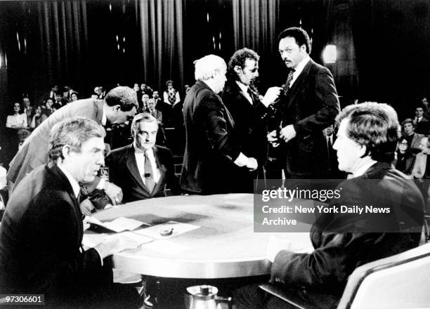 Dan Rather with candidates Walter Mondale , Gary Hart and Jesse Jackson , as they prepare for presidential debate at Columbia University.