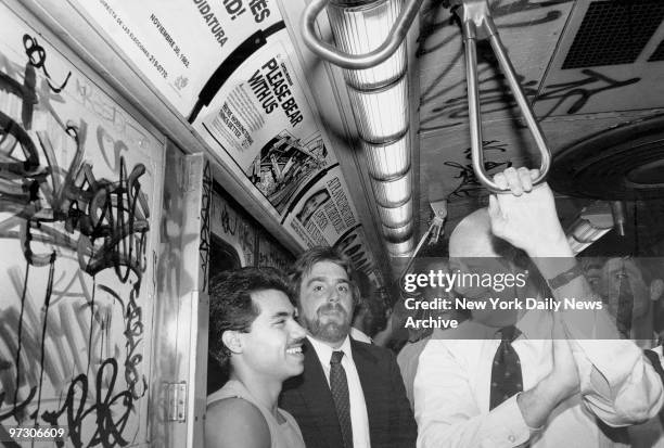 Mayor Ed Koch chats with Joey Valdez as he rides the R train in Brooklyn.