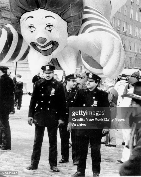 Some of New York's finest appear ready to be taken by BIg Mac's Ronald McDonald in the Macy's Thanksgiving Day Parade.