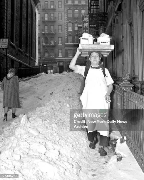 To the rescue of scores of stenogs, marooned in downtown Manhattan offices by slush-filed streets went Wong Song Lee. He brought them chop suey from...