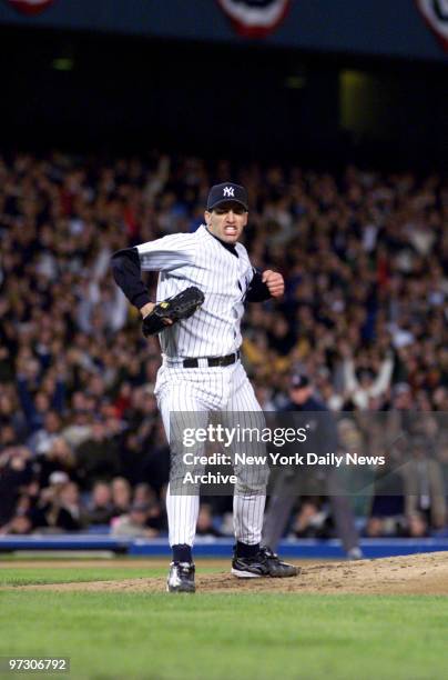 New York Yankees' pitcher Andy Pettitte reacts to retiring the side in the top of the fifth inning as the Yanks beat the Texas Rangers, 3-1, in Game...