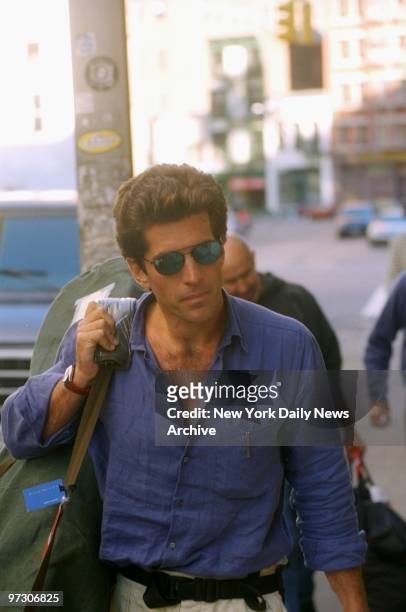 John F. Kennedy Jr. Returns to his Tribeca home after his honeymoon.