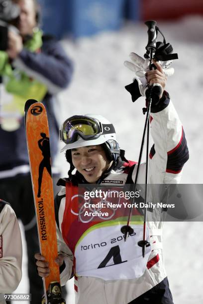 Toby Dawson of the U.S. Celebrates winning the bronze medal in the Men's Moguls Freestyle Skiing competition during the 2006 Winter Olympic Games at...