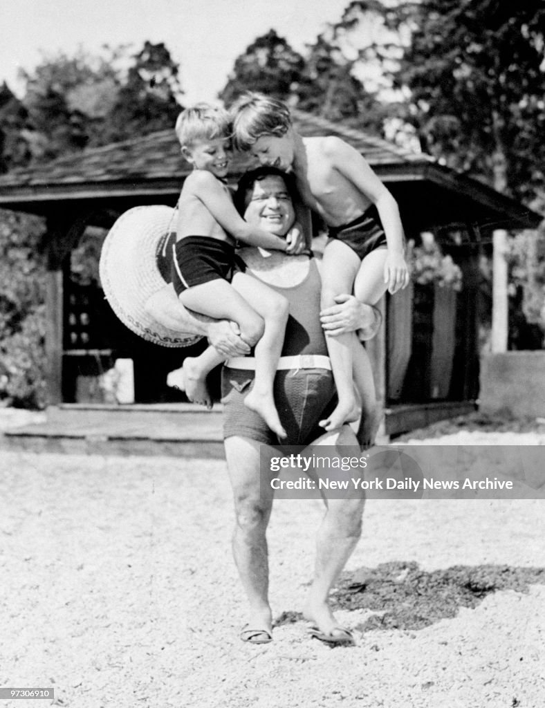 Mayor Fiorello LaGuardia holds his two children, Eric and Je