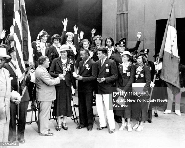 Mayor Fiorello LaGuardia presents New York City medals to Olympic winners Helen Stephens, Jesse Owens, Glenn Morris, Alice Arden and Betty Robinson...