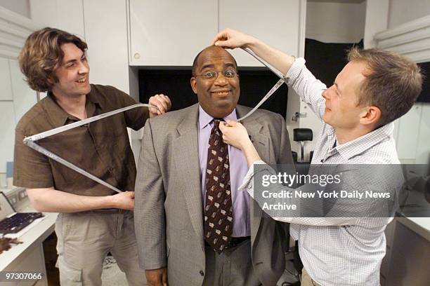 Today show weatherman Al Roker gets measured for a wax figure by artists from Madame Tussaud's Wax Museum. It will be on display at the new wax...