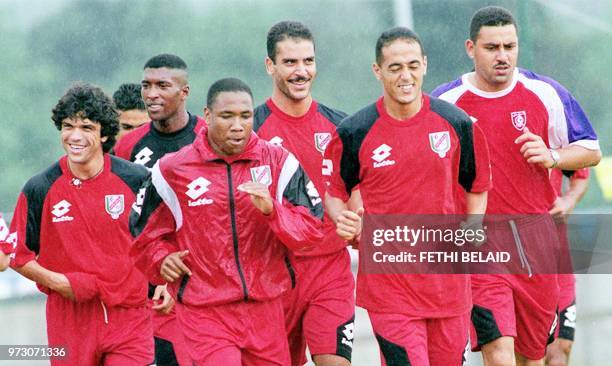 Players of the Tunisian national soccer team Riadh Bouazizi, Sabri Jaballah, Mehdi Ben Sliman, Sami Trabelsi, Ferid Chouchene and Radhouan Salhi run...