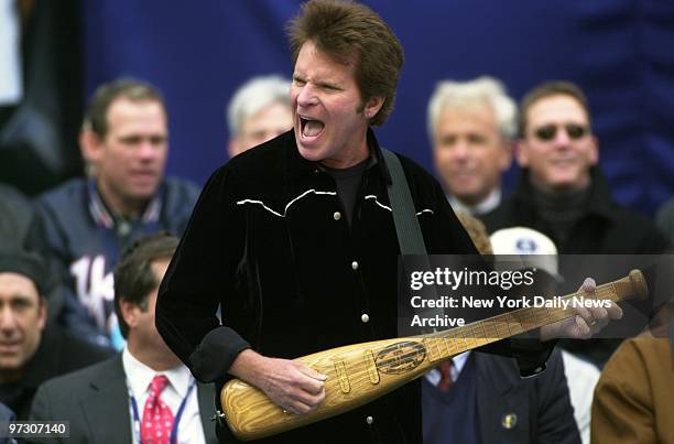 John Fogarty performs his baseball song "Centerfield" while playing a bat shaped guitar during the Yankees' victory celebration at City Hall. The...