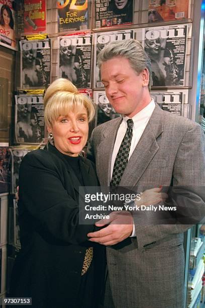 Gennifer Flowers is joined by a President Clinton impersonator in Penn Station where she signed copies of Oui magazine with a picture of her on the...