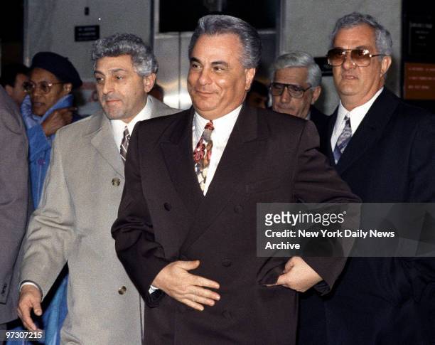 John Gotti with a smile on his face, older brother Peter Gotti and John D'Amico leave Manhattan Supreme Court where he is on trial on charges of...