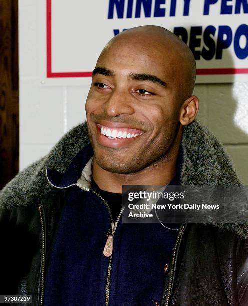 New York Giants' running back Tiki Barber smiles while speaking to the media after a practice session at Giants Stadium. Barber vows to be ready for...