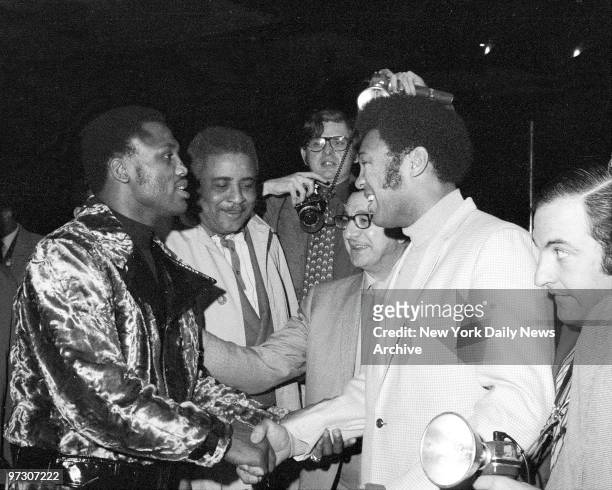 Toe-to-toe again, but not as opponents, Joe Frazier and Jimmy Ellis chat after the fight post-mortem.
