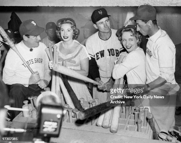 New York Giants' shortstop Alvin Dark is visited by Phil Regan, actress Audrey Meadows, Margaret Truman and jockey Eddie Arcaro in the visitors'...