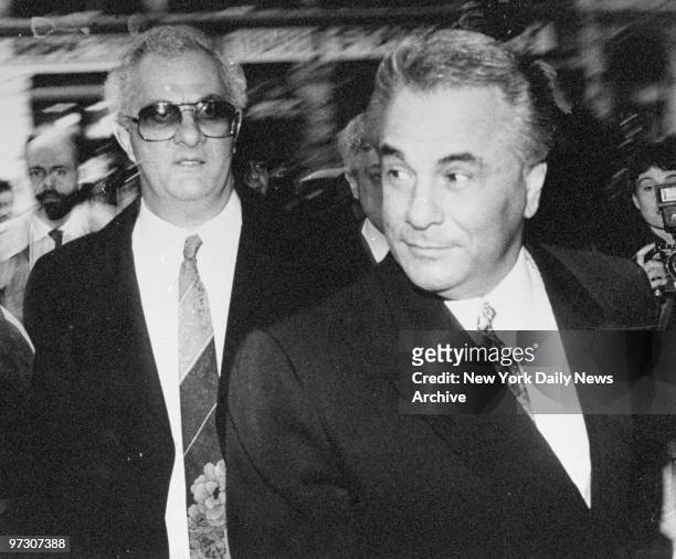 John Gotti arrives at Manhattan Supreme Court, where he is on trial on charges of conspiracy and assault, along with older brother Peter . The jury...