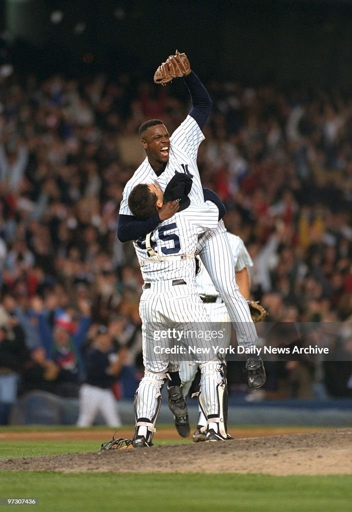 New York Yankees' pitcher Doc Gooden gives a cheer after pit