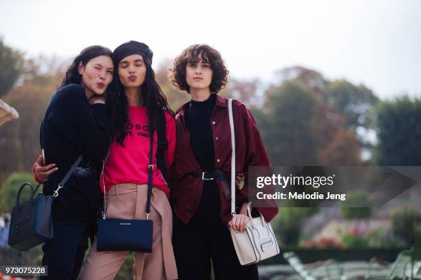 Brazilian models Angelica Erthal, Aira Ferreira, Leila Zandonai during Paris Fashion Week Spring/Summer 2018 on September 27, 2017 in Paris, France....