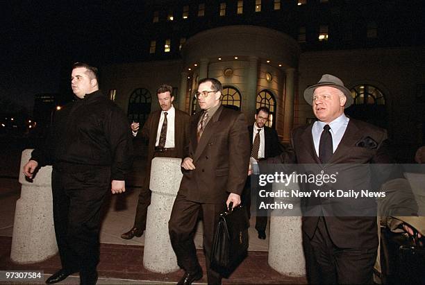 John Gotti Jr. Leaves White Plains courthouse after pleading guilty to racketeering charges on the eve of his trial. Gotti is flanked byt his...