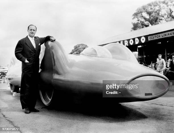 British pilote Donald Campbell, speed record breaker, poses in England in July 1960, near the Bluebird CN7 designed to achieve 475500 mph to try to...