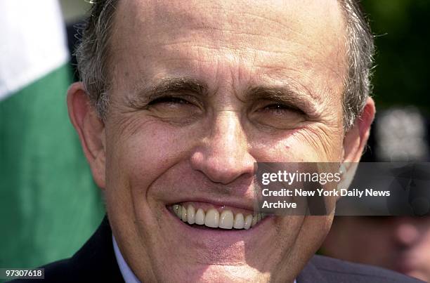 Mayor Giuliani smiles as he speaks to media after marching in the Memorial Day Parade in Douglaston, Queens. The mayor was also marking his 57th...