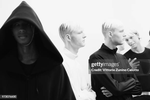 Models are seen backstage ahead of the Fumito Ganryu show during the 94th Pitti Immagine Uomo on June 13, 2018 in Florence, Italy.