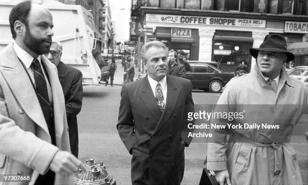 John Gotti with his lawyers enters court on Centre Street where judge granted prosecution request to sequester jury.