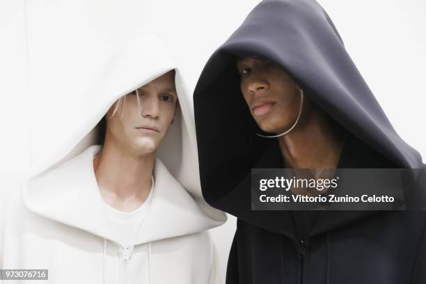 Models are seen backstage ahead of the Fumito Ganryu show during the 94th Pitti Immagine Uomo on June 13, 2018 in Florence, Italy.