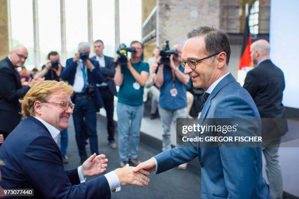 German Foreign Minister Heiko Maas greets the Chairman of the Board of the Schwarzkopf Foundation Andre Schmitz as he arrives to deliver a speech on...