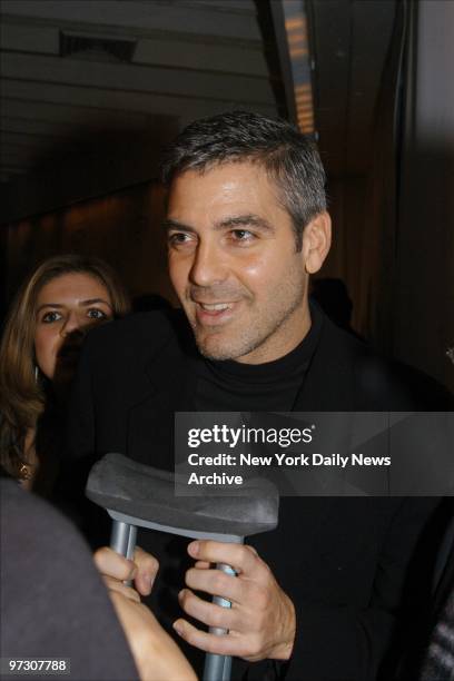 George Clooney arrives on crutches at Tavern on the Green where the National Board of Review held its annual awards gala. He won Special Filmmaking...