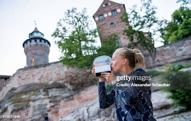 Johanna Larsson of Sweden celebrates winning the singles final during Day 8 of the WTA Nuernberger Versicherungscup on May 26, 2018 in Nuremberg,...
