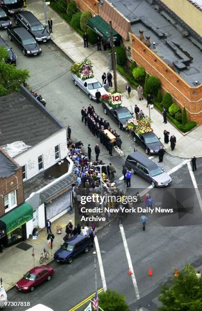 John Gotti's coffin is carried to a waiting hearse by pallbearers outside the Papavero Funeral Home in Maspeth, Queens, after a funeral service for...