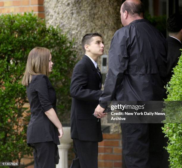 John Gotti's grandchildren arrive for his wake at the Papavero Funeral Home in Maspeth, Queens