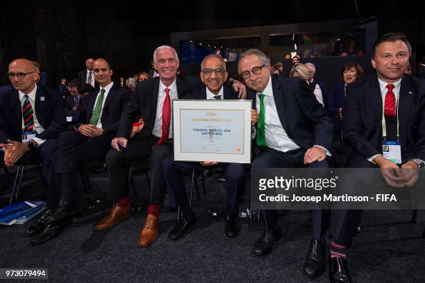 Steven Reed, Carlos Cordeiro and Decio De Maria pose during the 68th FIFA Congress at Expotsentr on June 13, 2018 in Moscow, Russia.