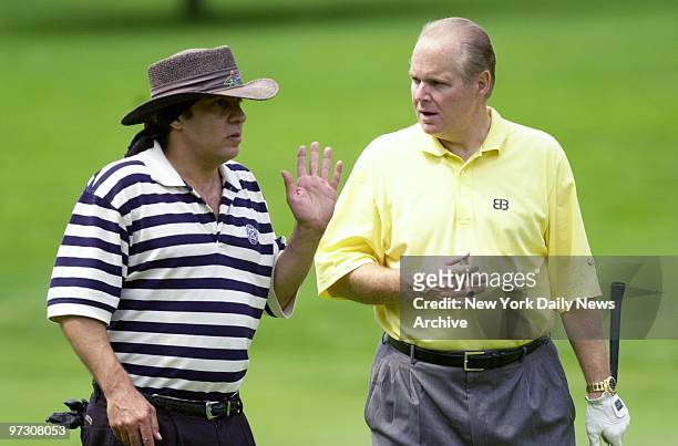 Sopranos star Steve Van Zandt and Rush Limbaugh have a chat on the fairway at the Sybase Big Apple Classic at Wykagyl Country Club in New Rochelle.