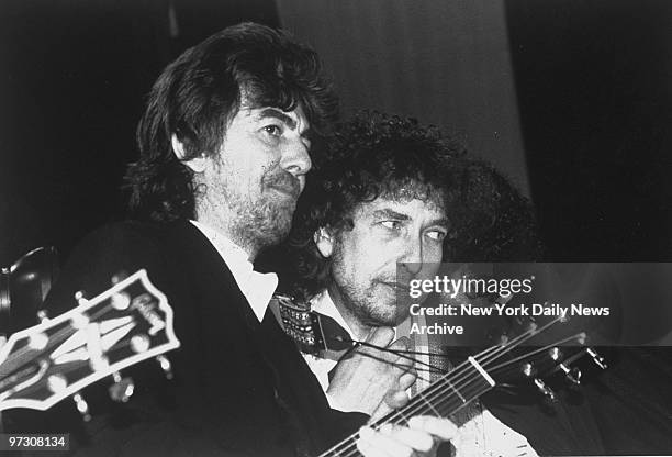 George Harrison and Bob Dylan at the Rock 'n' Roll Hall of Fame induction ceremonies at the Waldorf-Astoria.