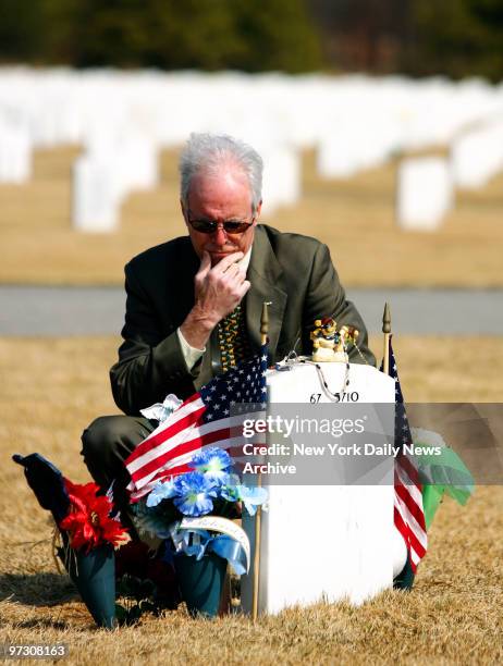 Daniel Murphy visits the gravesite of his son, Navy SEAL Lt. Michael Murphy, at the Calverton National Cemetery in Long Island on Tuesday. Lt. Murphy...