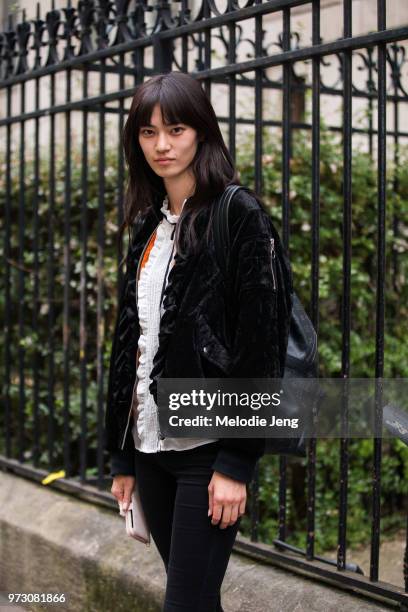 Japanese model Miki Ehara in a black flight jacket during Paris Fashion Week Spring/Summer 2018 on September 30, 2017 in Paris, France.
