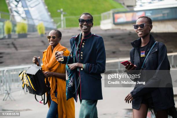 African models Naro Lokuruka, Nykhor Paul, Shanelle Nyasiase during Paris Fashion Week Spring/Summer 2018 on September 30, 2017 in Paris, France....