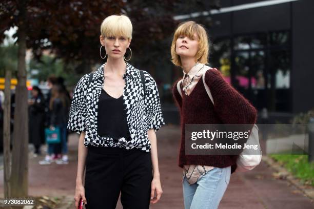 Models Daria Kozak, Irina Kravchenko after Balenciaga during Paris Fashion Week Spring/Summer 2018 on October 1, 2017 in Paris, France.