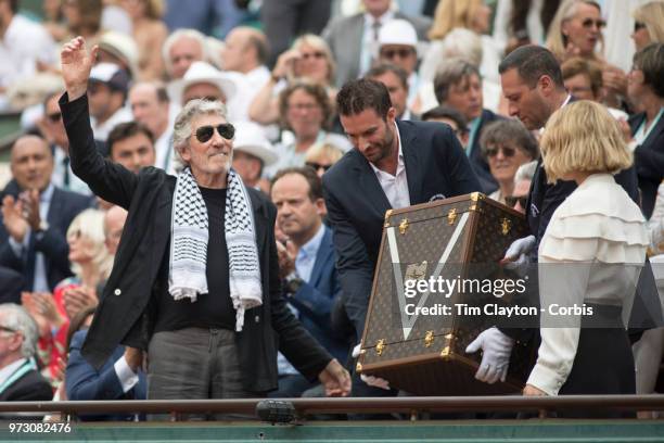 June 10. French Open Tennis Tournament - Day Fifteen. Roger Waters and Lea Seydoux present the men's final trophy before the Rafael Nadal of Spain...