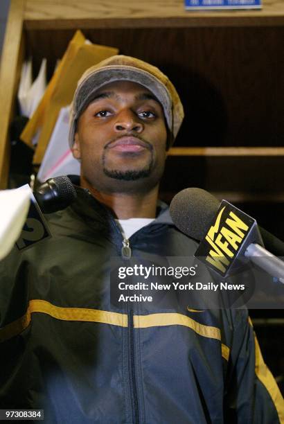 New York Giants' wide receiver Jim Amani Toomer speaks to media in the locker room at Giants Stadium the day after his team blew a 24-point lead and...