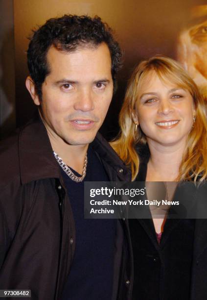 John Leguizamo and wife Justine Maurer arrive at the Ziegfeld Theatre for the premiere of the movie "There Will Be Blood."