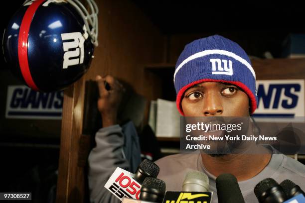 New York Giants' wide receiver Plaxico Burress speaks to the media during a news conference in the locker room at Giants Stadium. The Giants will be...