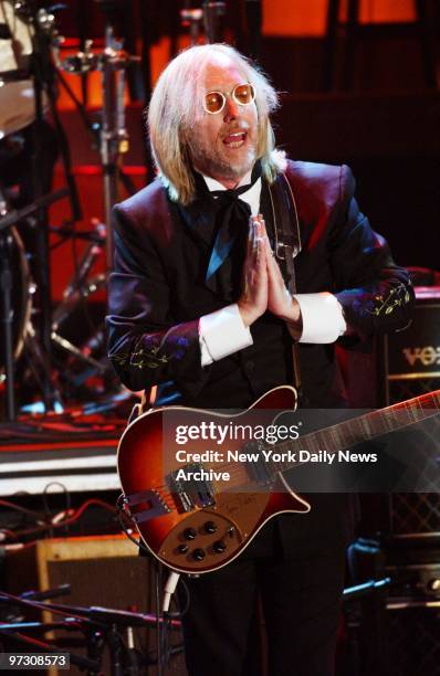 Tom Petty performs at the Waldorf-Astoria where he was inducted into the Rock and Roll Hall of Fame.